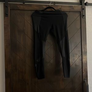 Black athletic tights. 90 degree. Size M.